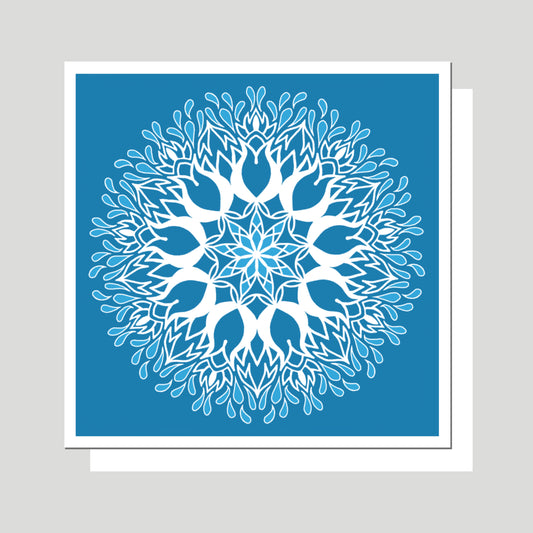 This is an image of the greeting card titled "Garden Square Mandala" The Mandala Art on the card depicts a "Well Watered Garden,"  The background is a gentle blue which backdrops a white mandala that fades to a lighter blue at the edges.  Original Artwork by Jennifer Knight, newwingstudio.com